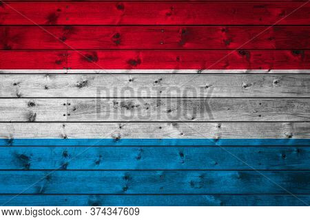 The National Flag Of Luxembourg Is Painted On A Camp Of Even Boards Nailed With A Nail. The Symbol O