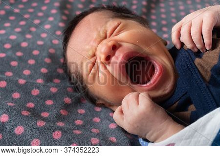 Asian Newborn Baby Boy With Skin Peeling Still Sleepy And Yawning After Wake Up In The Bedroom In Th
