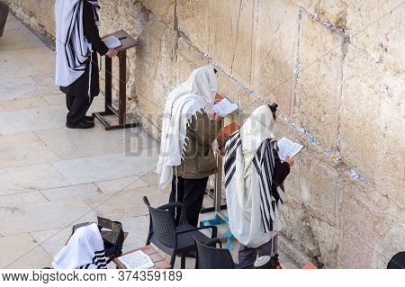 Jerusalem, Israel - 15.04.2015. Orthodox Jewish Men Pray At Western Wall In The Morning