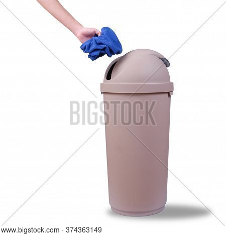 Hand Push A Trash Into Big Brown Trashcan Or Waste Bin On White Background.