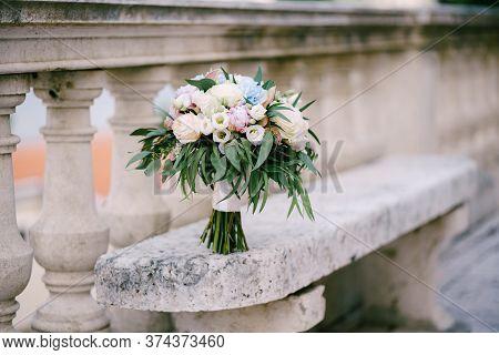 Bridal Bouquet Of White And Pink Roses, Peonies, Hortense Branches Of Eucalypt Tree, Eustoma And Whi