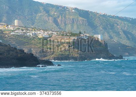 View On Ocean Shore And Colorful Buildings On The Rock In Punta Brava, Puerto De La Cruz, Tenerife, 