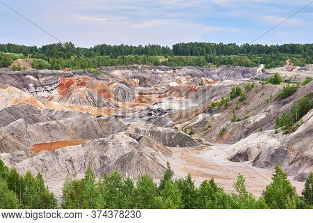 Multi-colored Eroded Hills And Destroyed Soil Layer At The Open Cast Mining Site Of Kaolin