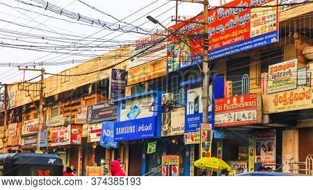 Vijayawada, INDIA - January 6 2019 : Colorful hoardings and signs of small businesses along the street, at Vijayawada, India