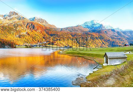 Awesome Autumn Panorama Of Silvaplana Lake And Surlej Village. Location: Silvaplana, Maloya District
