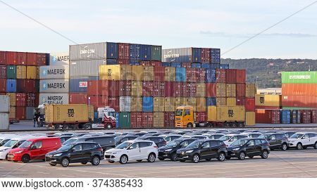 Koper, Slovenia - October 14, 2014: New Cars And Cargo Containers At Terminal Port In Koper, Sloveni
