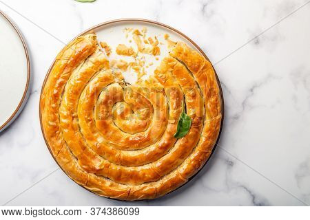 Filo Spinach And Feta Twist Pie In The Iron Pan After Oven. Authentic Greek Bakery. With Spinach, Mi