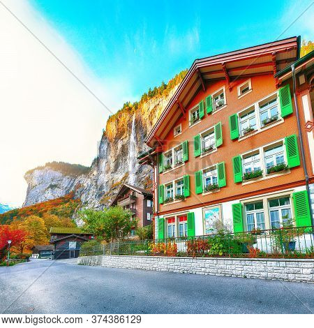 Fantastic Autumn View Of Lauterbrunnen Village With Awesome Waterfall  Staubbach  In The Background.