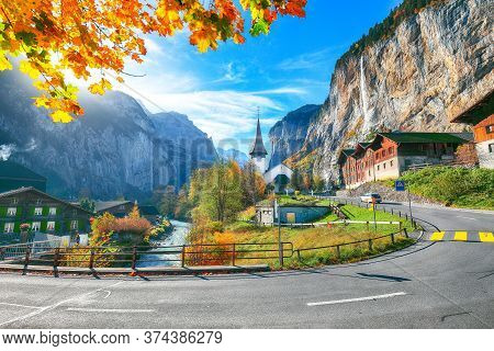 Stunning Autumn View Of Lauterbrunnen Village With Awesome Waterfall  Staubbach  And Swiss Alps In T