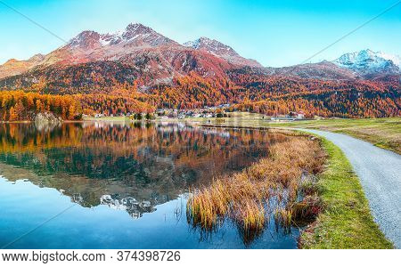 Stunning Autumn Panorama Of Silvaplana Lake And Surlej Village.  Mirror Reflaction In Lake. Location