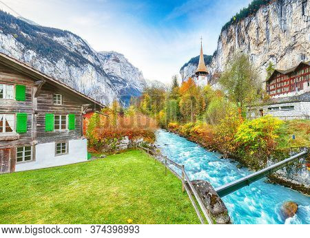 Stunning Autumn View Of Lauterbrunnen Village With Awesome Waterfall  Staubbach  And Swiss Alps In T