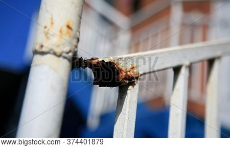 Salvador, Bahia / Brazil - July 1, 2020: Rust Is Seen On A Stairway Protection Grid In The Neighborh