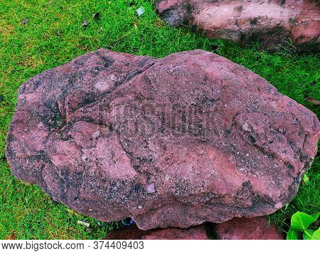 Beautiful Big Rock Laying In The Green Ground