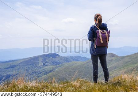 Woman Hiking In Nature In Mountain. Traveling In Nature. Woman Hiking Outdoor Backpacking In Nature.