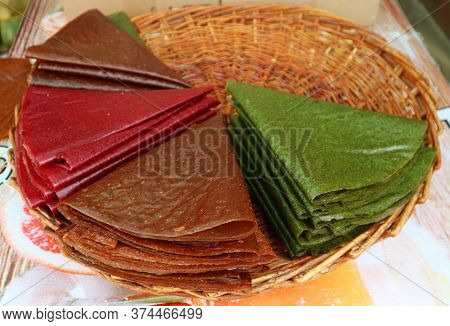 Traditional Georgian Sun-dried Pureed Fruit Sheets Called Tklapi In A Basket