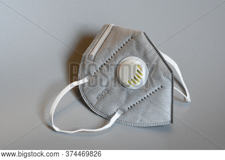 Kn95 Or N95 Mask With Valve For Protection Pm 2.5 And Corona Virus On Grey Background. Prevention Of