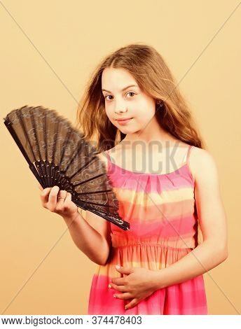 Summer Heat. Fresh Air. Kid Girl Fanning Herself With Fan. Cooling And Ventilation. Conditioning Sys