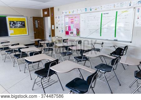 West Islip, New York, Usa - 3 June 2020: A High School Classroom With Empty Desks And No Students Du