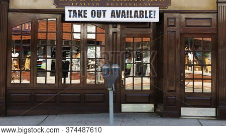 Babylon, New York, Usa - 28 June 2020: An Italian Restaurant Has A Sign That Reads Take Out Availabl