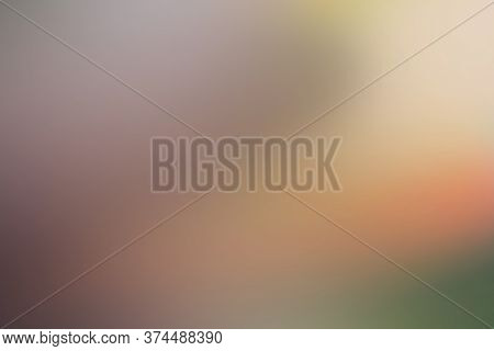 Abstract Blurred Background In Brown, Orange, Green Color