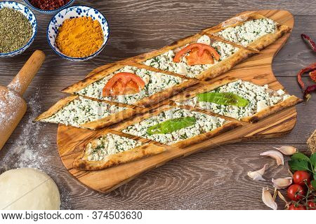 Traditional Turkish Baked Dish Pide. Turkish Pizza Pide, Middle Eastern Appetizers. Turkish Cuisine.