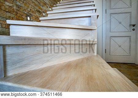 Stylish Wooden Contemporary Staircase Inside Loft House Interior. Modern Hallway With Decorative Lim
