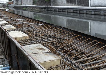 Steel Reinforcing Tie Wire Work At Construction Site Of Embankment For Canal Path And Protecting Riv