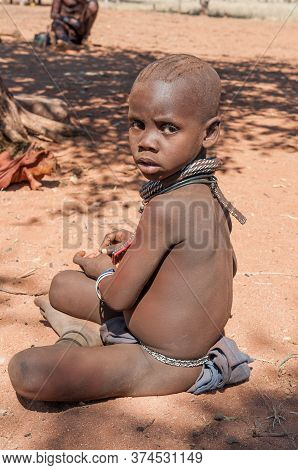 Epupa, Namibia - May 27, 2011: An Young Himba Boy Posing For Photographers At A Himba Village Near E
