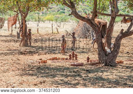 Epupa, Namibia - May 27, 2011: Himba Children Playing At A Himba Village Near Epupa. Himba Crafts Ar
