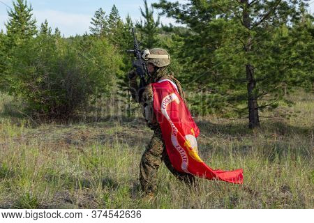 Fully Armed American Soldier With Us Marine Corps Flag In The Summer Forest, Active Military Game Ai
