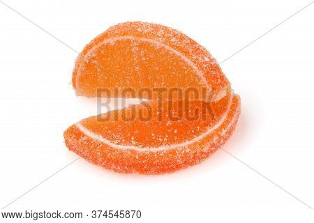 Composition Of Marmalade Candy In Shape Of Citrus Fruits Wedges. Yellow And Orange Jelly Sweet Candi