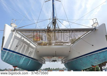 A Large Catamaran Yacht With A Double Hull Seen From Below