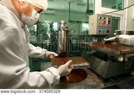 Ilheus, Bahia / Brazil - August 7, 2011: Employee Is Seen In A Chocolate Gurmet Factory In The City 