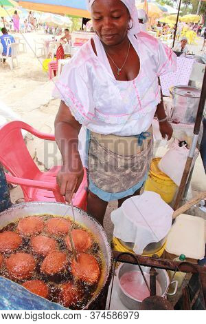 Salvador, Bahia / Brazil - October 7, 2012: Baiana De Acaraje Prepares Food At A Stall In Downtown S