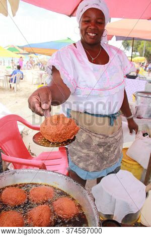 Salvador, Bahia / Brazil - October 7, 2012: Baiana De Acaraje Prepares Food At A Stall In Downtown S