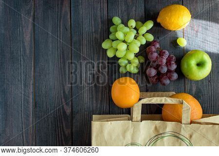 Orange, Lemon, Apple, Grapefruit, Grapes In A Paper Bag.