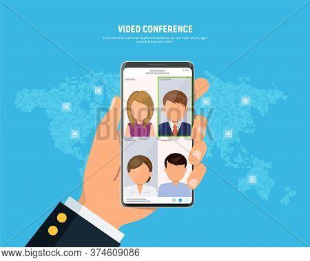 Businessman Holds Phone With Video Conferencing On Screen. Online Meeting Concept. People On Phone S