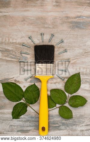 Yellow Construction Brush, Nails And Leaves In The Form Of A Flower. Daddys Day Postcard Concept.