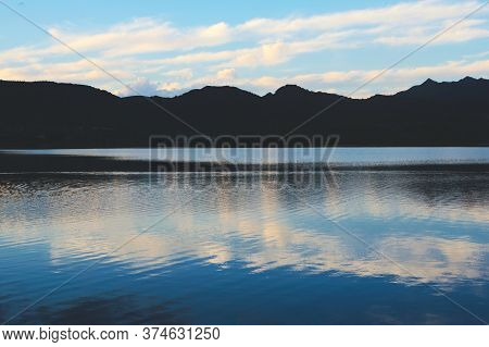 Blue Twilight Sky Reflected On The Waters Of Lake Potrero De Los Funes, In San Luis, Argentina.