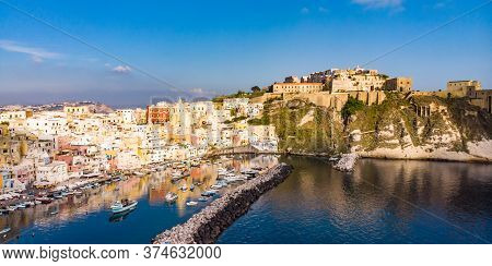 Aerial Drone View Of Vibrantly Colorful Houses Of Marina Corricella In Sunny Summer Weather At Proci