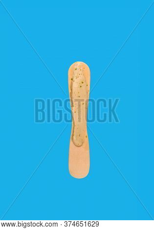 Popsicle Stick With A Little Bit Left Of On Blue Background
