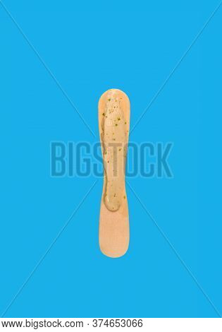 Popsicle Stick With A Little Bit Left Of On Blue Background