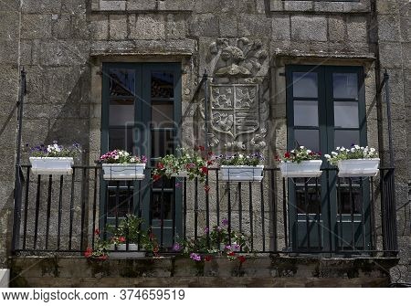 Santiago De Compostela (spain), July 3, 2020. House Emblazoned With A Balcony And Flowers. The Histo
