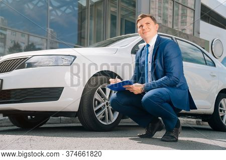 A Man Writes In A Tablet Next To The Car. An Accident On The Road, The Airbag Didnt Work.