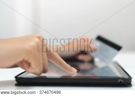 Close Up Hand Of Person Shopping In Mobile And Paying Via Internet Bank.