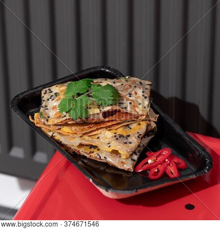 Top View Of Fried Chinese Pancake Or Fried Steamed Dumpling Made Of Garlic Chives, Rice Flour And Ta