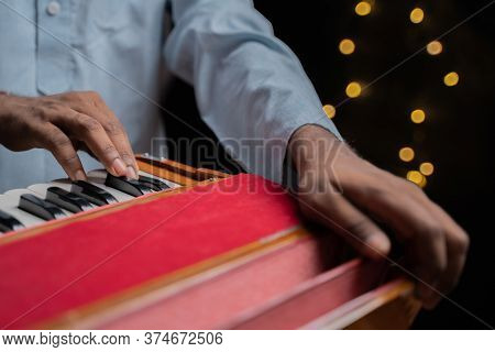 Hands Playing Indian Music Instrument Harmonium In Music Concert