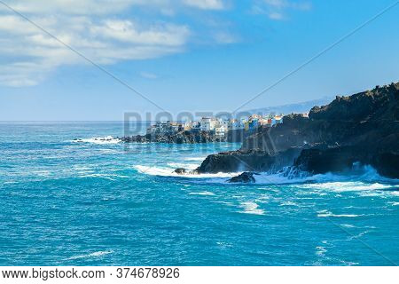 View On Ocean Shore And Colorful Buildings On The Rock In Punta Brava, Puerto De La Cruz, Tenerife, 