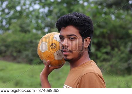 A Boy Is Standing With A Football And Watching In Front In The Road 5 July 2020 In Mandla Road, Indi
