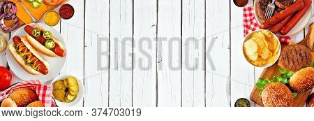 Summer Bbq Food Table Scene With Hot Dog And Hamburger Buffet. Top View Double Border Over A White W